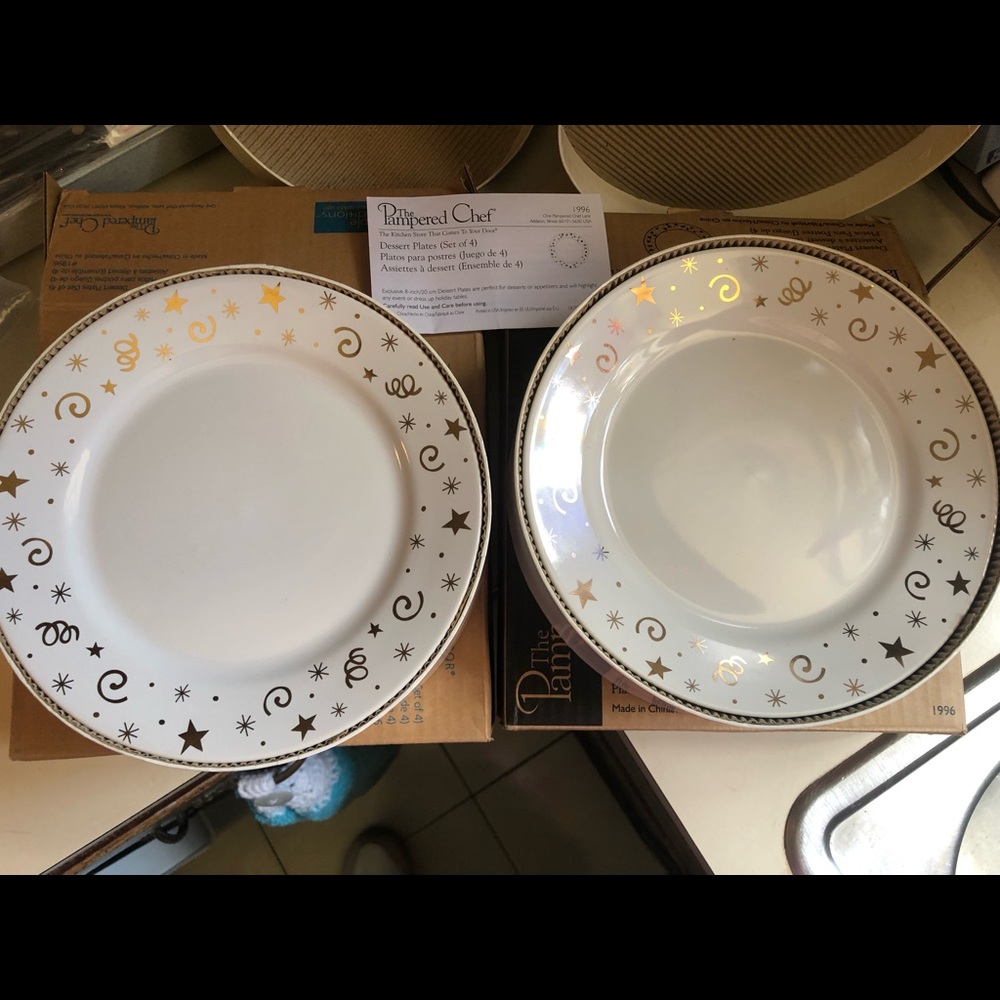 1 set of 4 - 8” dessert plates by Pampered Chef.  Celebration!!! Dessert plates